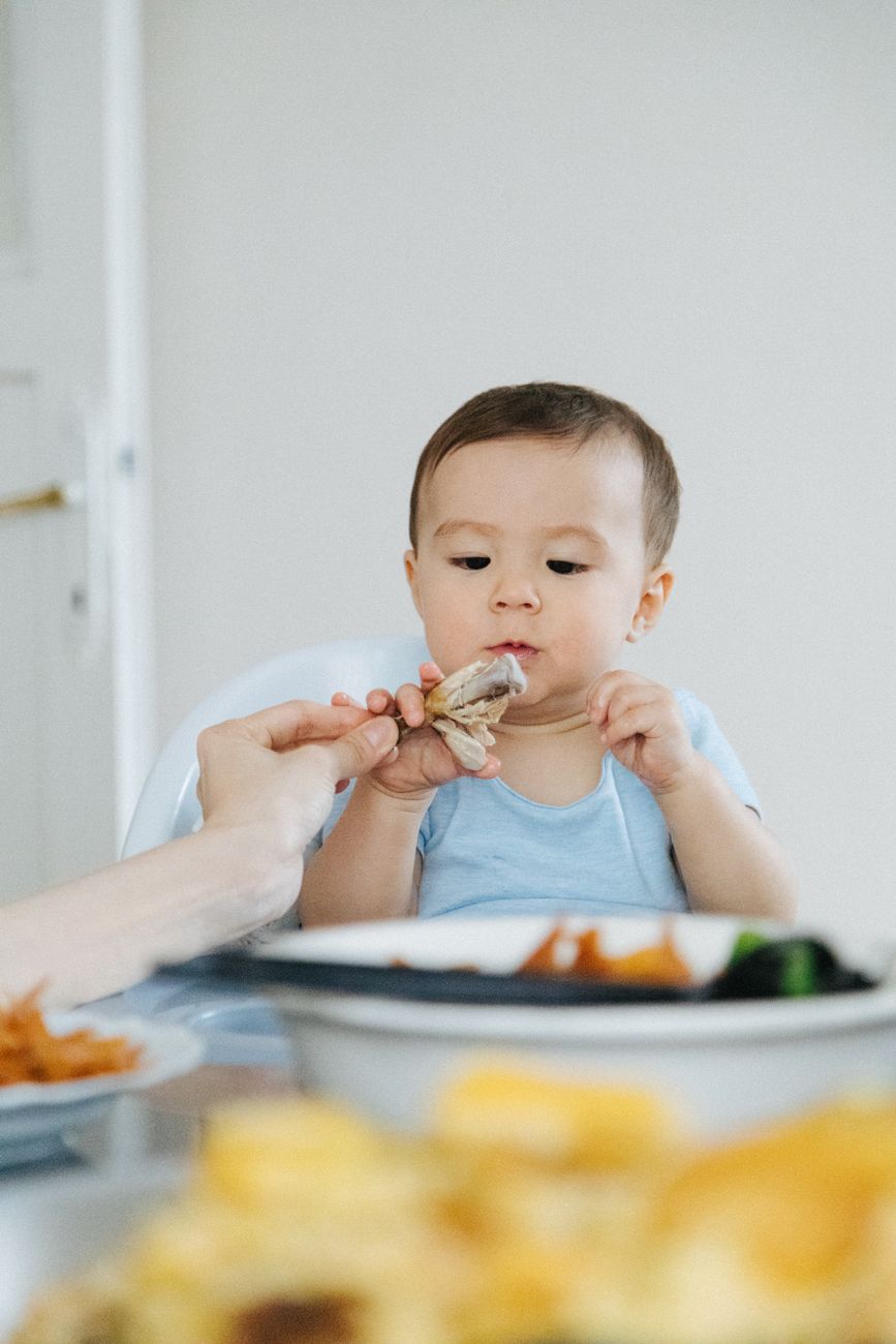 an infant eating food